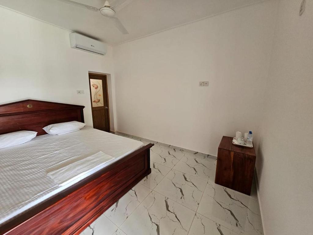 Postel nebo postele na pokoji v ubytování Alpha Bungalow - Kandy