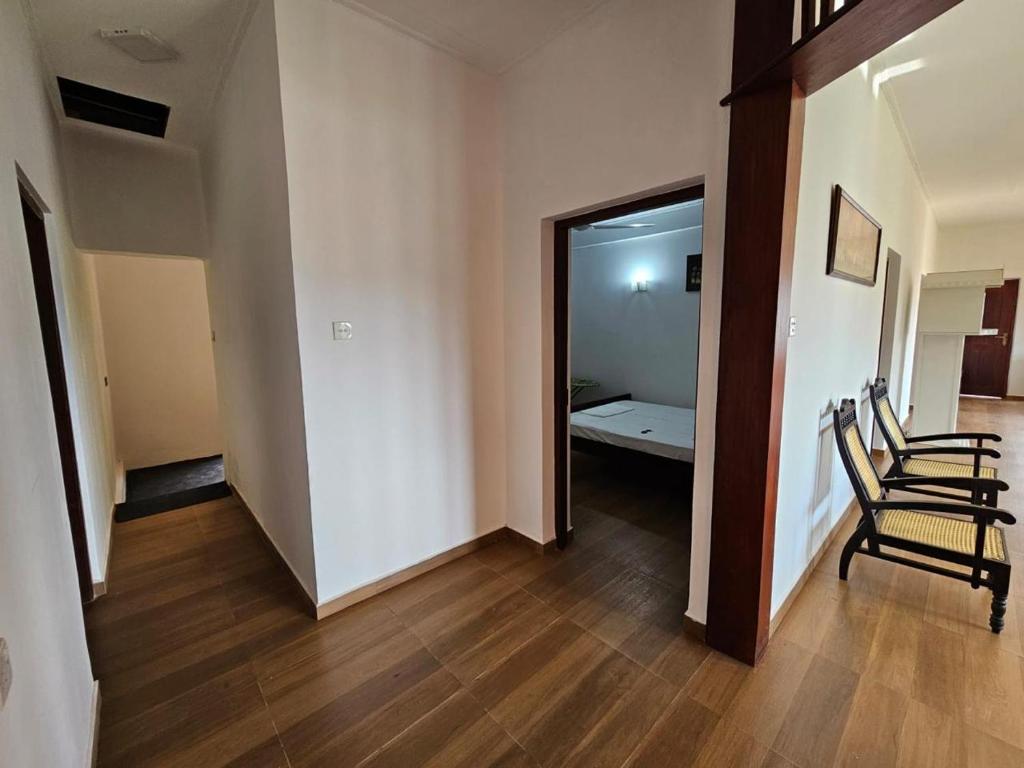 Postel nebo postele na pokoji v ubytování Alpha Bungalow - Kandy