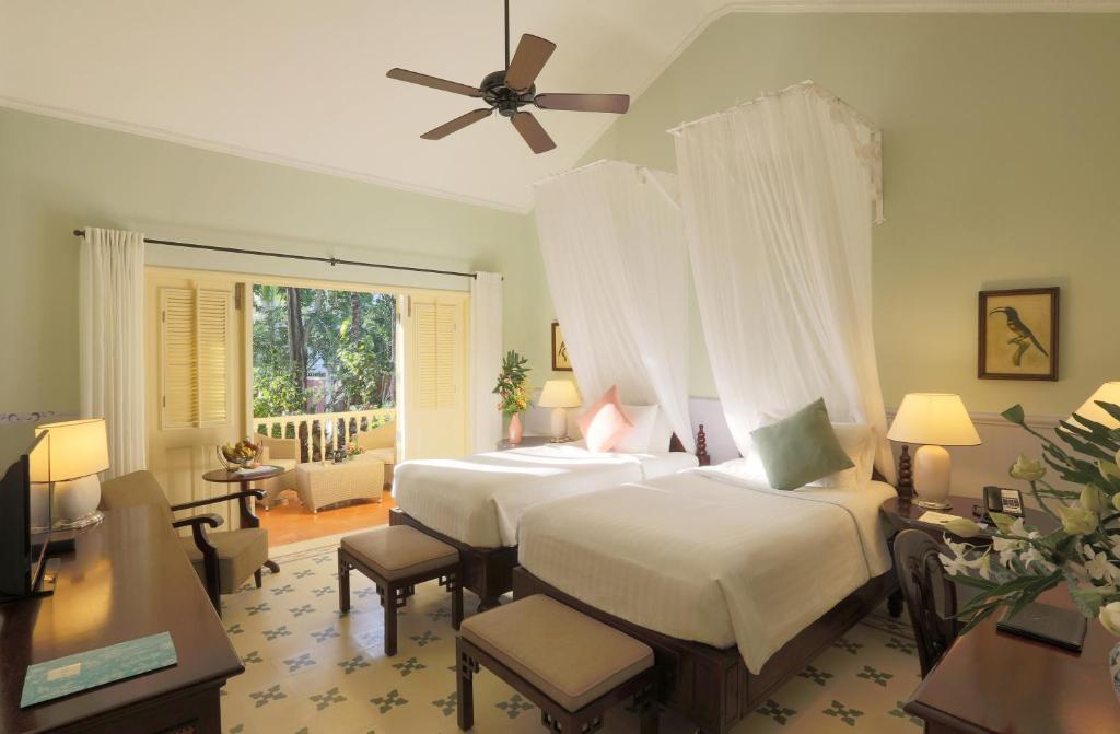 Postel nebo postele na pokoji v ubytování La Veranda Resort Phu Quoc - MGallery