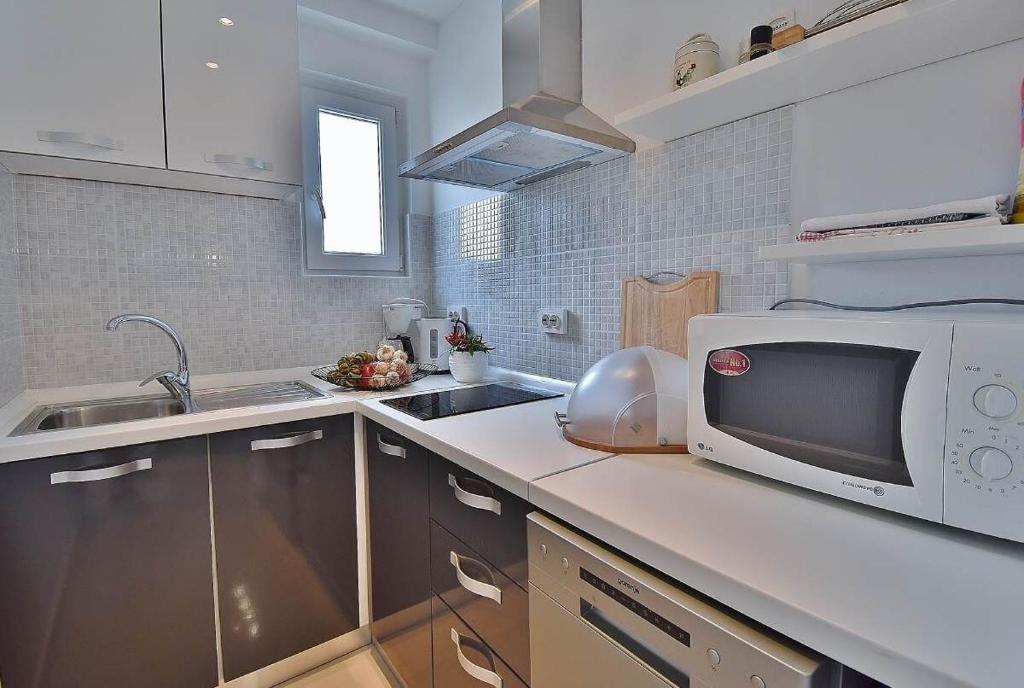 Kuchyň nebo kuchyňský kout v ubytování Apartments Ruzica