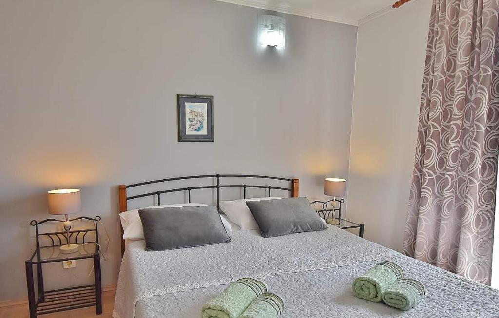 Postel nebo postele na pokoji v ubytování Apartments Ruzica