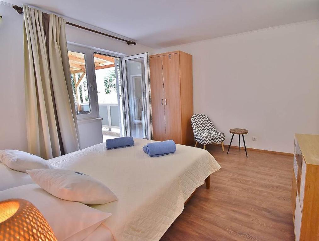Postel nebo postele na pokoji v ubytování Apartments Ruzica