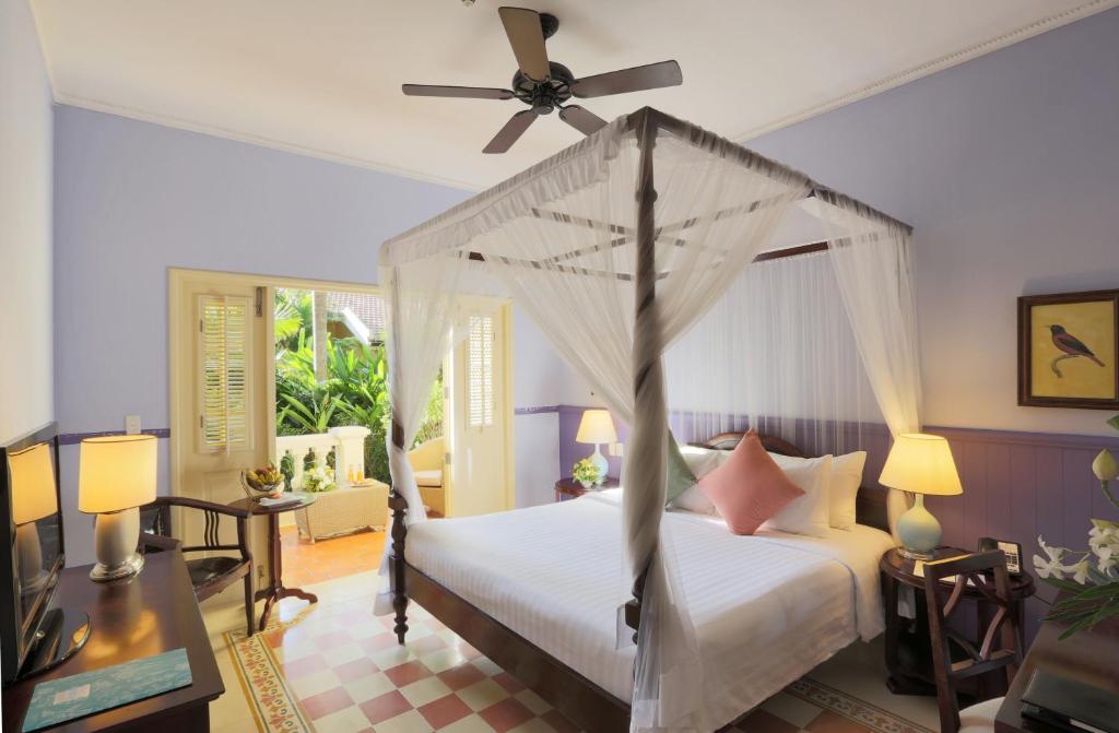 Postel nebo postele na pokoji v ubytování La Veranda Resort Phu Quoc - MGallery