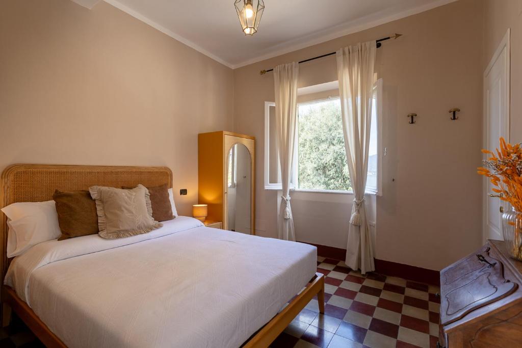 Łóżko lub łóżka w pokoju w obiekcie Castello Canevaro