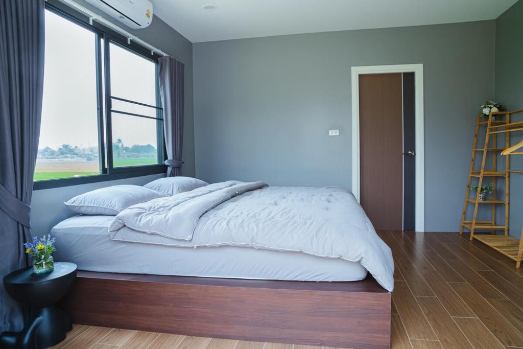 Postel nebo postele na pokoji v ubytování Kirin's House Mae Taeng Chiangmai