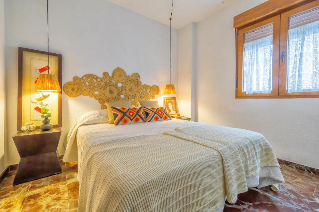 Postel nebo postele na pokoji v ubytování Apartamento con Parking El Patio de La Muralla