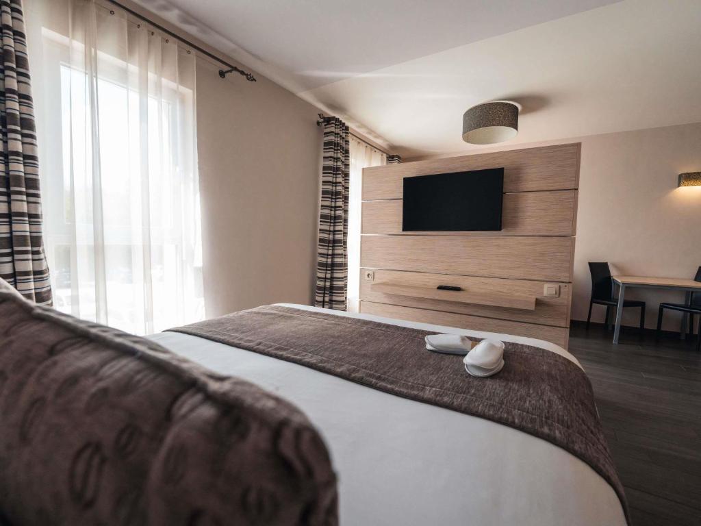 Uma cama ou camas num quarto em Ibis Styles Charleroi Airport Aero 44