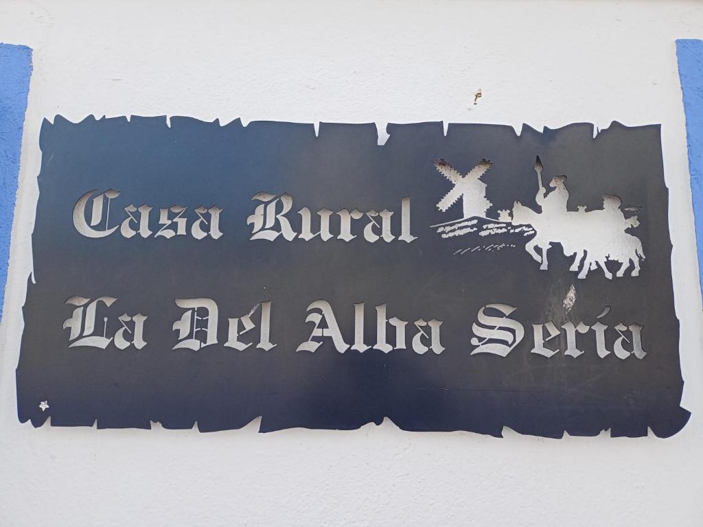 a sign on a wall that reads united kingdom in al ain syndrome at Casa Rural La del Alba Sería in Argamasilla de Alba