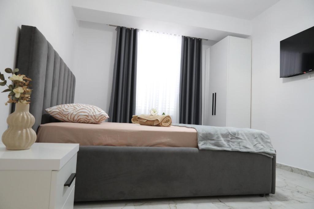 TV a/nebo společenská místnost v ubytování Rozafa Guest Room Center