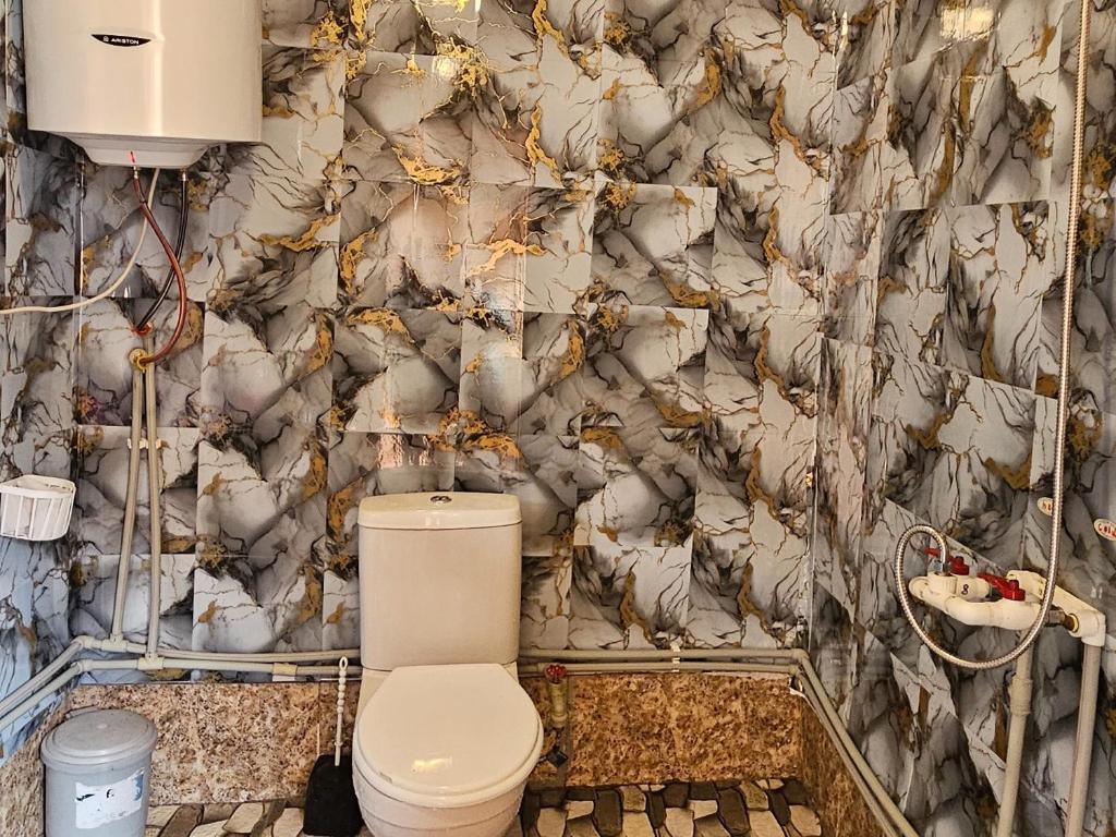 Koupelna v ubytování MURQVAMI Guesthouse