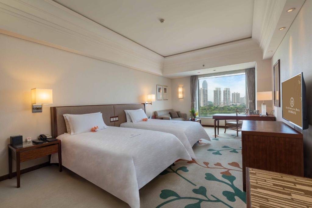 TV a/nebo společenská místnost v ubytování Huizhou Kande International Hotel