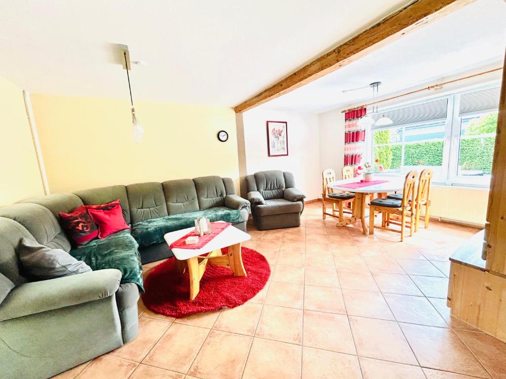 a living room with a couch and a table at Ferienhof Eckhoff in Fehmarn