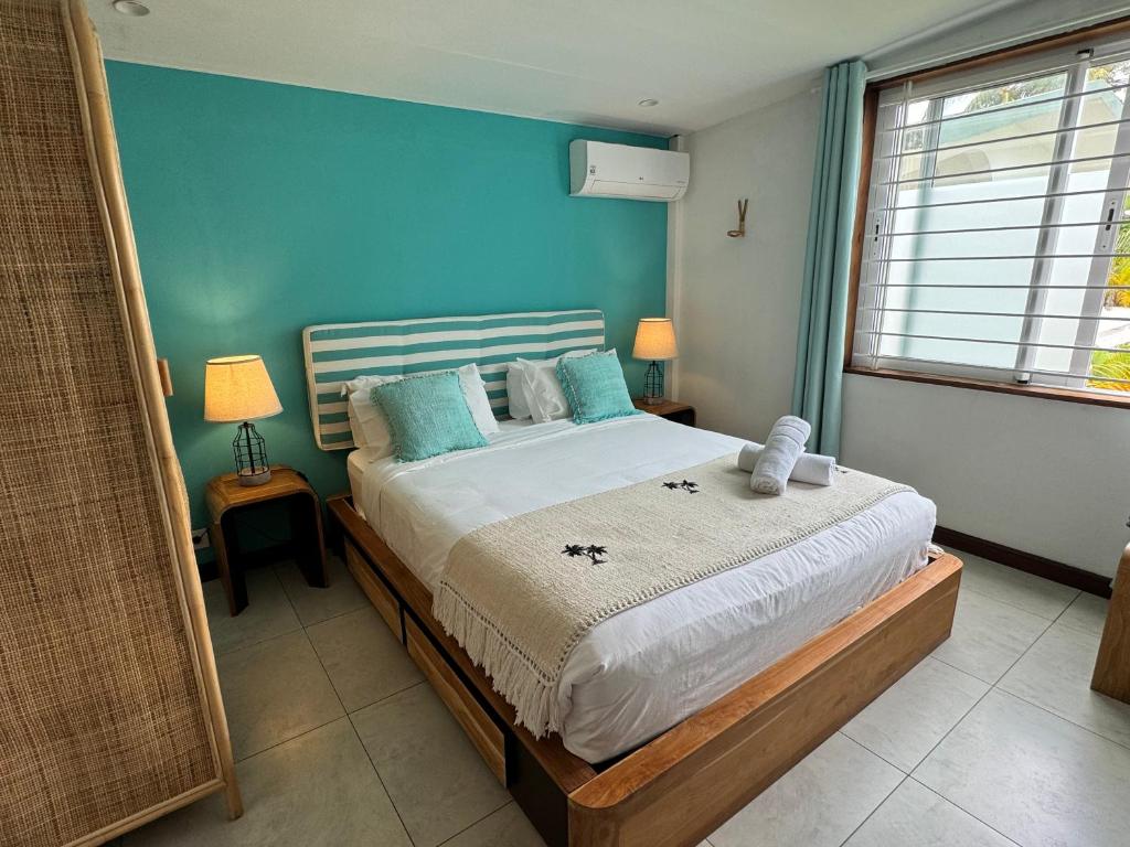 Postel nebo postele na pokoji v ubytování Blue Ocean Suites & Apartments