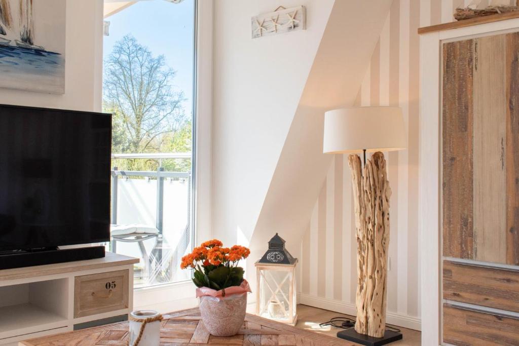 TV a/nebo společenská místnost v ubytování Ferienwohnung Windjammer