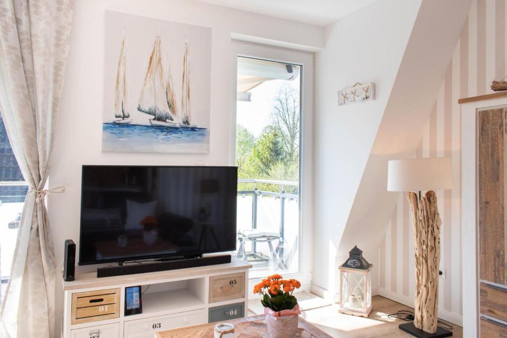 TV a/nebo společenská místnost v ubytování Ferienwohnung Windjammer