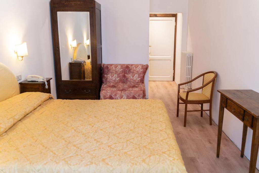 Postel nebo postele na pokoji v ubytování Hotel Belvedere