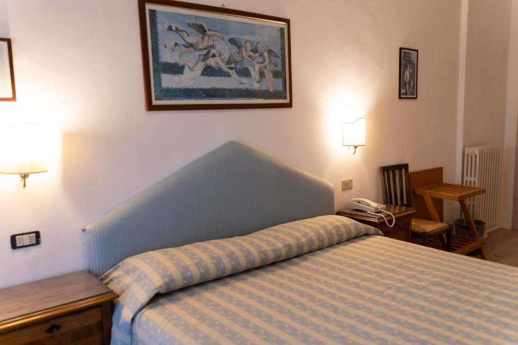 Postel nebo postele na pokoji v ubytování Hotel Belvedere