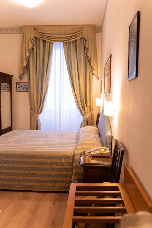Postel nebo postele na pokoji v ubytování Hotel Belvedere