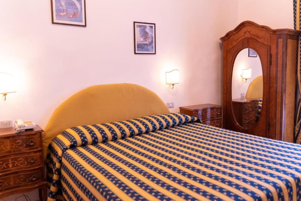 Postel nebo postele na pokoji v ubytování Hotel Belvedere