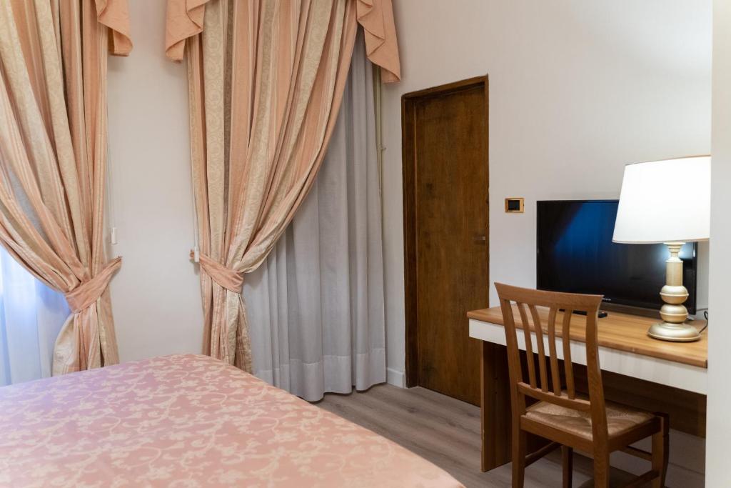 Postel nebo postele na pokoji v ubytování Hotel Belvedere