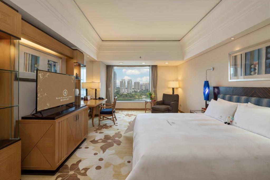 Postel nebo postele na pokoji v ubytování Huizhou Kande International Hotel