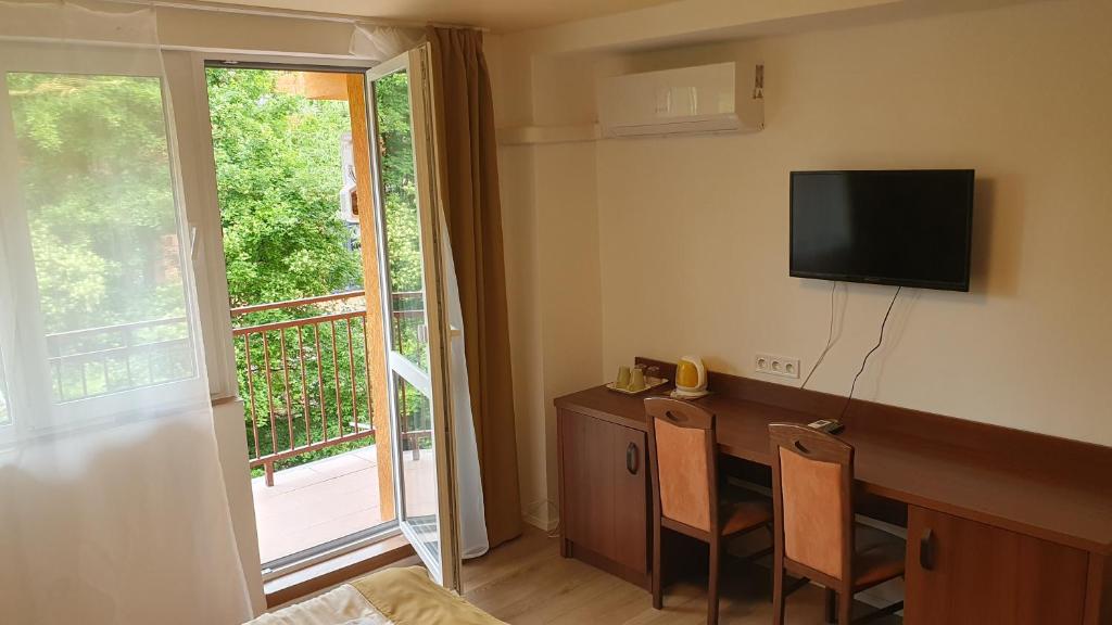 TV a/nebo společenská místnost v ubytování Hotel Felicia