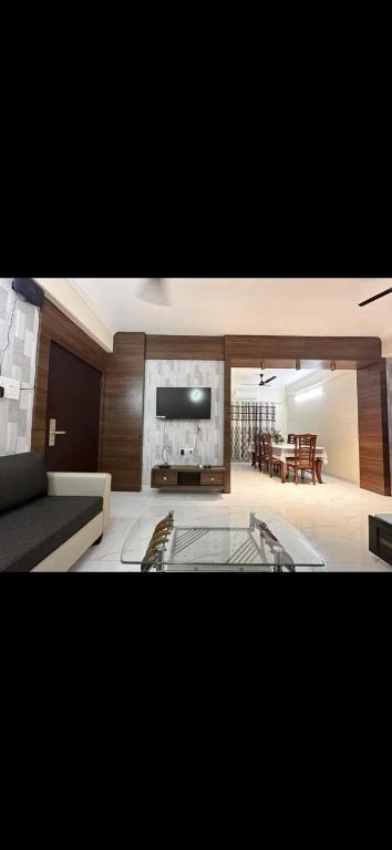 a living room with a couch and a table at Virat in Jāmb