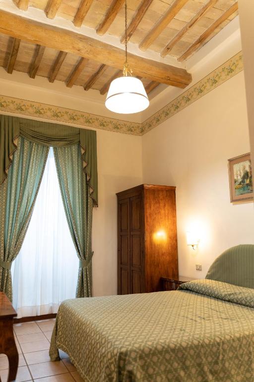 Postel nebo postele na pokoji v ubytování Hotel Belvedere