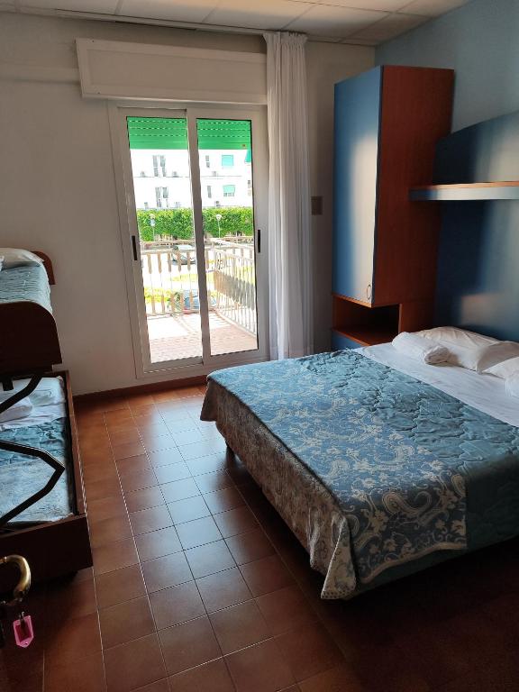 Postel nebo postele na pokoji v ubytování Hotel Trifoglio