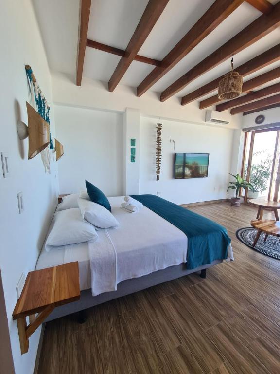 Postel nebo postele na pokoji v ubytování Intiquilla Hotel