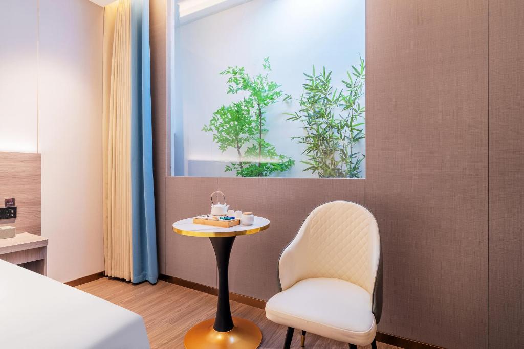 Postel nebo postele na pokoji v ubytování ChongQing Could Hotel 重庆云禧酒店