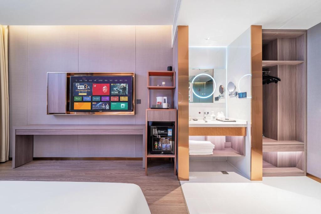 Postel nebo postele na pokoji v ubytování ChongQing Could Hotel 重庆云禧酒店