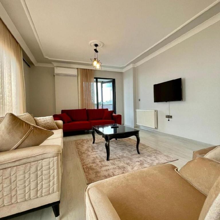 Posezení v ubytování Shahin Golden Hotel الصقر الذهبي للشقق الفندقية