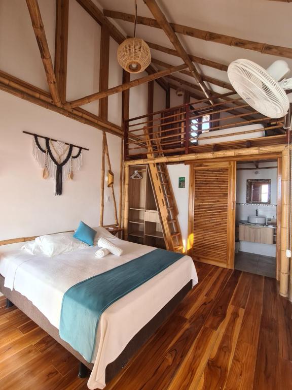 Postel nebo postele na pokoji v ubytování Intiquilla Hotel