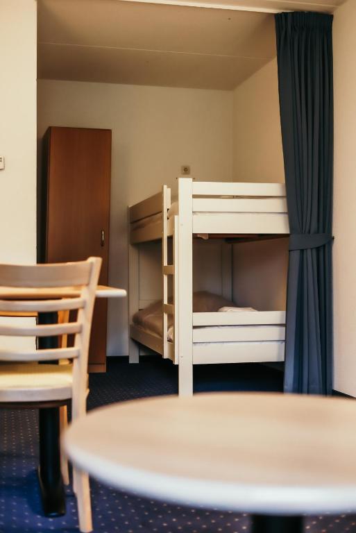 Een bed of bedden in een kamer bij Hotel Hardenberg