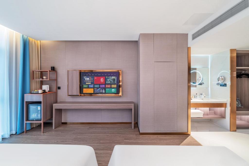 Postel nebo postele na pokoji v ubytování ChongQing Could Hotel 重庆云禧酒店