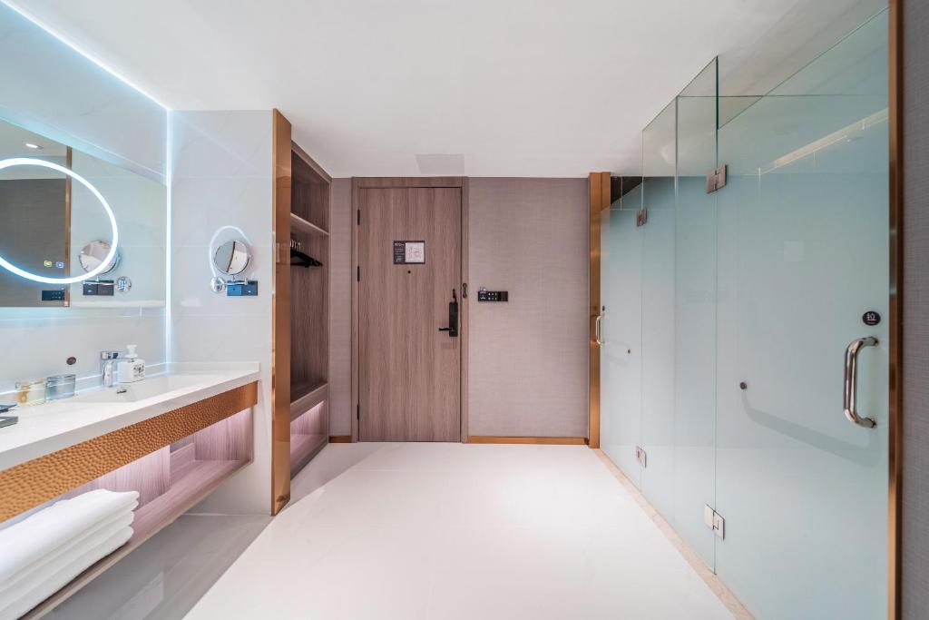 Postel nebo postele na pokoji v ubytování ChongQing Could Hotel 重庆云禧酒店