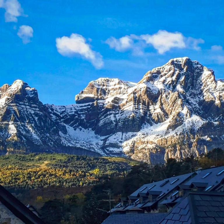 a view of a snow covered mountain at El Betato in Tramacastilla de Tena