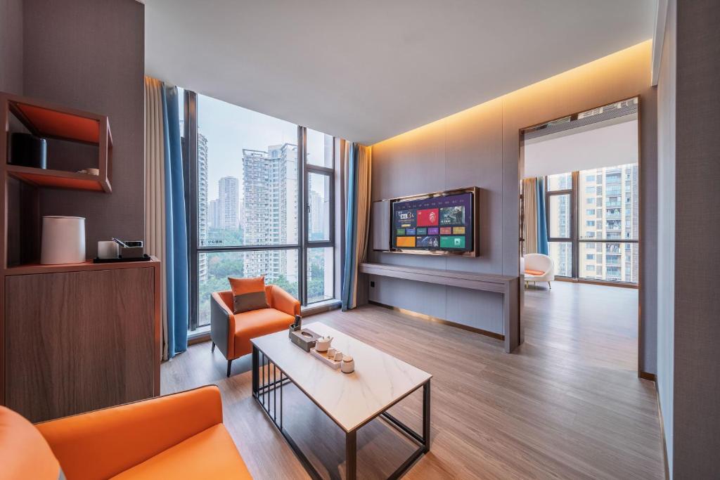 TV a/nebo společenská místnost v ubytování ChongQing Could Hotel 重庆云禧酒店