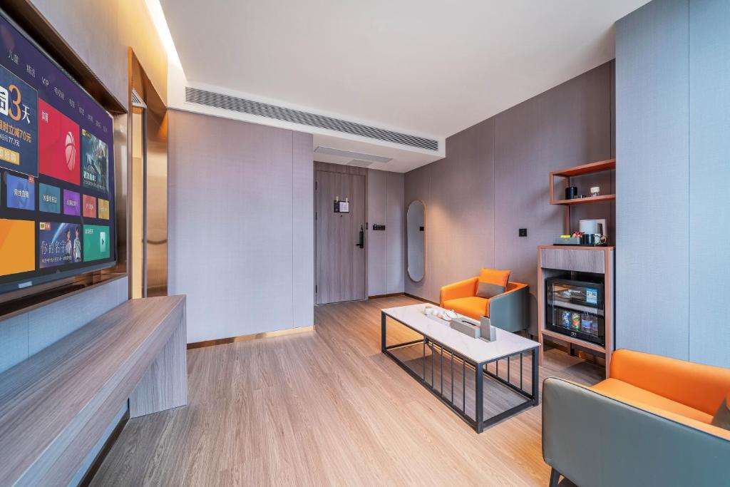 TV a/nebo společenská místnost v ubytování ChongQing Could Hotel 重庆云禧酒店