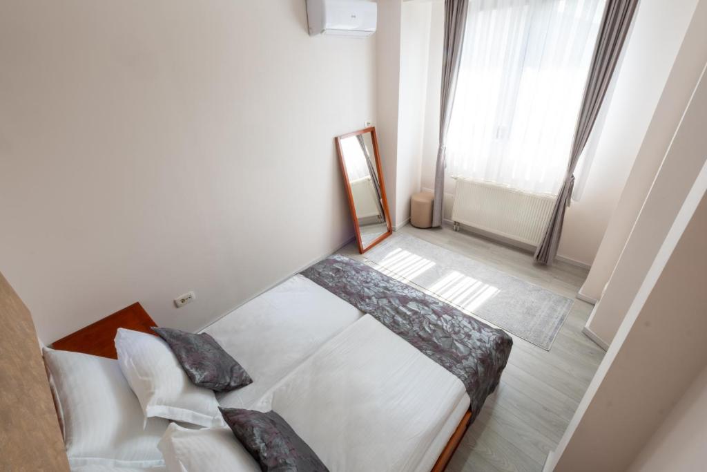 Postel nebo postele na pokoji v ubytování Hotel Bosna 1