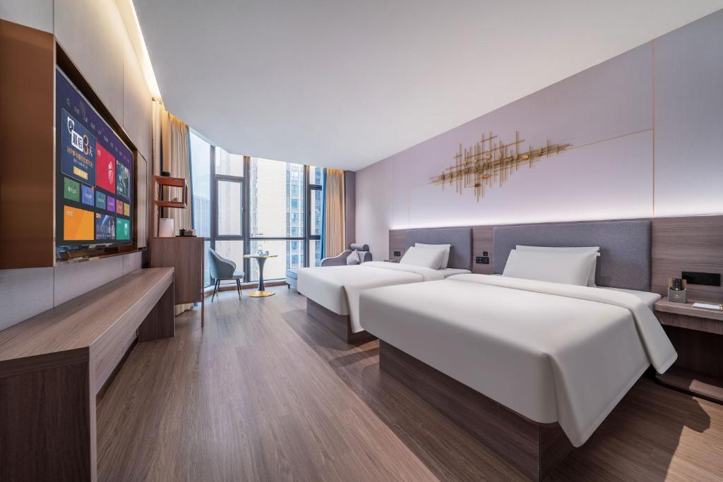Postel nebo postele na pokoji v ubytování ChongQing Could Hotel 重庆云禧酒店