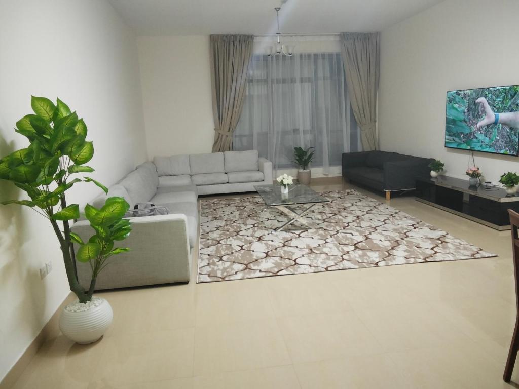 Prostor za sedenje u objektu Al Khor Tower Apartment