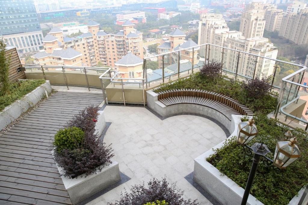 a set of stairs with a view of a city at Green Court Residence Jinqiao Diamond Shanghai in Shanghai