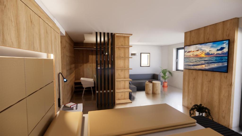 Televízia a/alebo spoločenská miestnosť v ubytovaní Hotel Gabriela