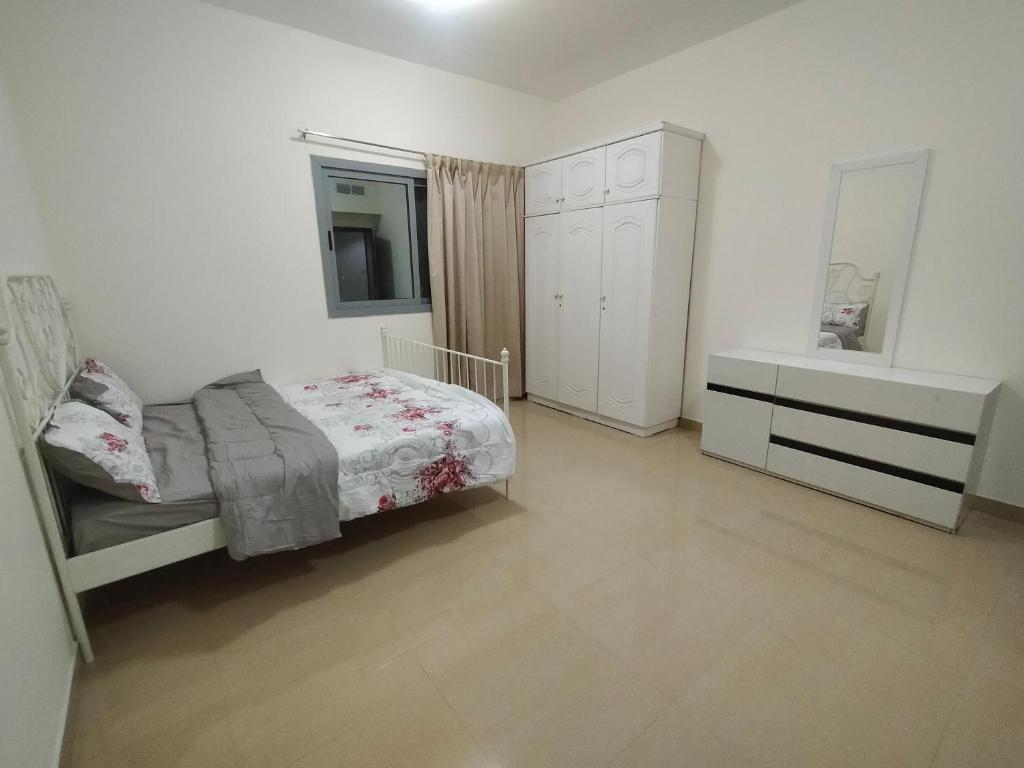 Krevet ili kreveti u jedinici u okviru objekta Al Khor Tower Apartment