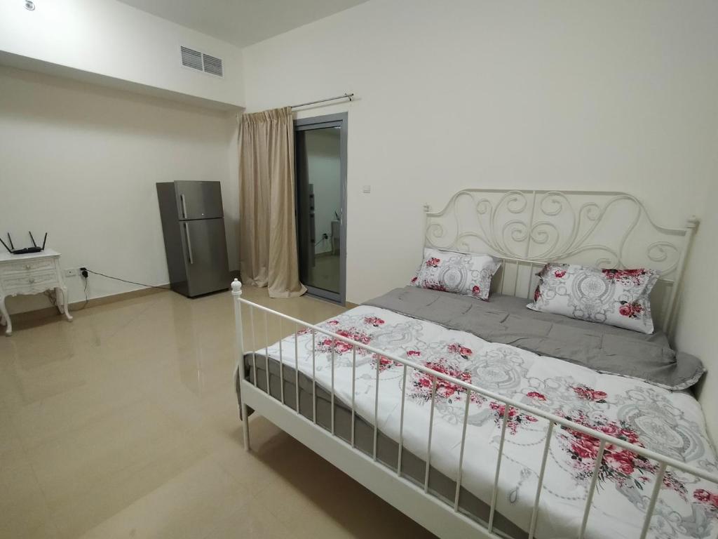 Krevet ili kreveti u jedinici u okviru objekta Al Khor Tower Apartment