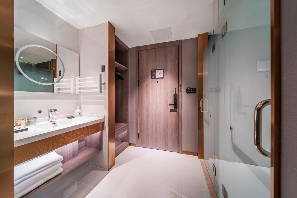 Postel nebo postele na pokoji v ubytování ChongQing Could Hotel 重庆云禧酒店