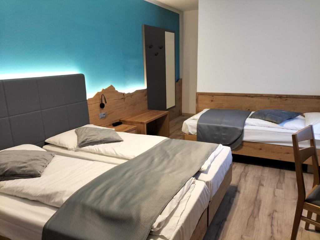 Postel nebo postele na pokoji v ubytování Hotel Angelo