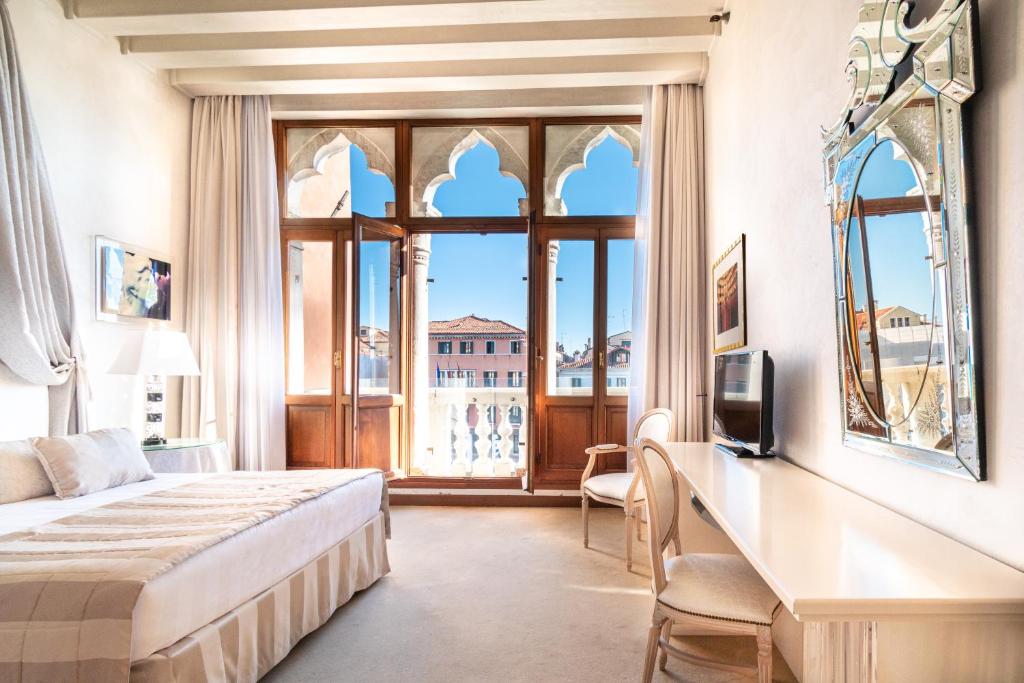 Postel nebo postele na pokoji v ubytování Hotel Principe